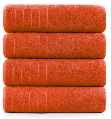 600-GSM bath sheet in seven vibrant colors neatly stacked on a table